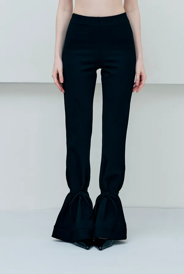 A pair of trousers photographed on a phone